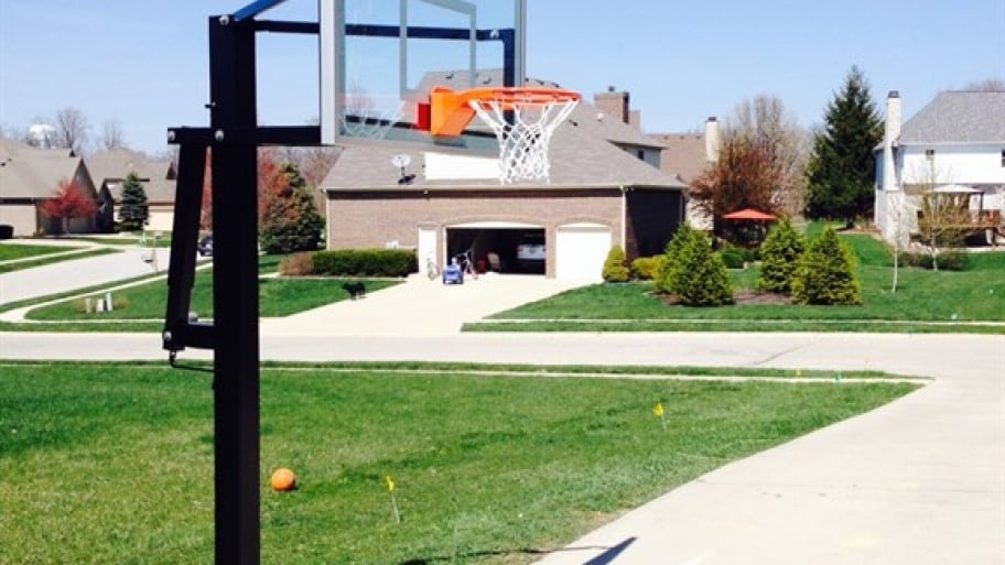 basketball hoop in front of a home